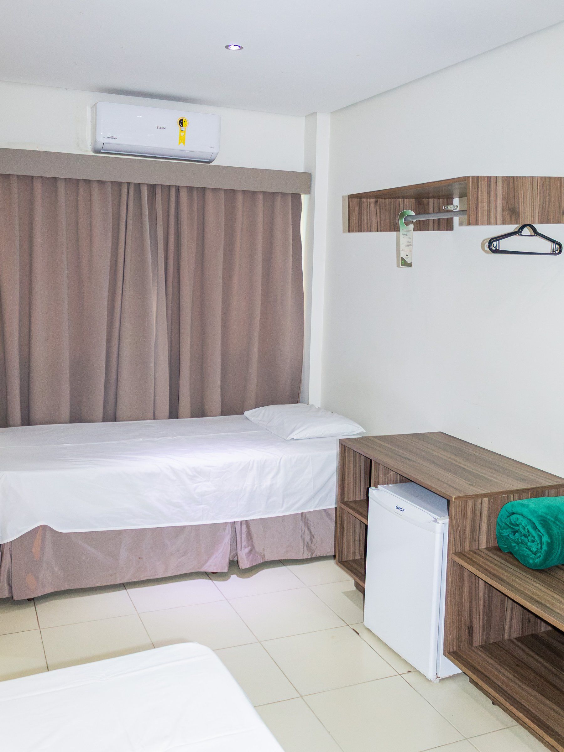 Deluxe Triple room, single bed, minibar and the second bed in the foreground